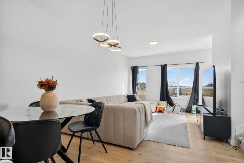 Living area featuring light wood-style flooring - 382 Crystallina Nera Drive, Edmonton, AB - Indoor