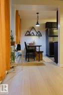 Dining space featuring light wood-style flooring and baseboards - 