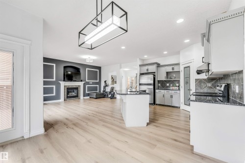 3319 18 Street, Edmonton, AB - Indoor Photo Showing Kitchen With Fireplace