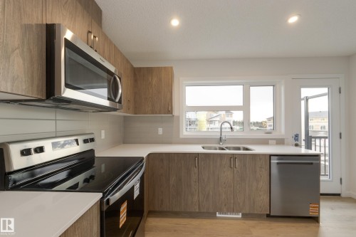 17233 4 Street, Edmonton, AB - Indoor Photo Showing Kitchen With Stainless Steel Kitchen With Double Sink
