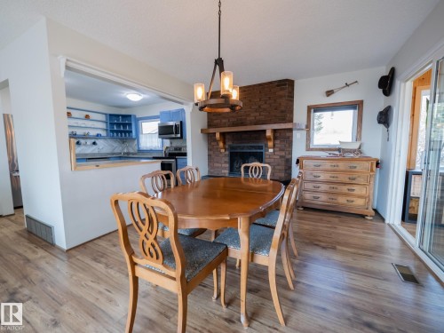 403 4 Street, Rural Lac Ste. Anne County, AB - Indoor Photo Showing Dining Room With Fireplace