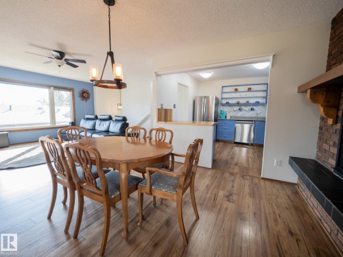 403 4 Street, Rural Lac Ste. Anne County, AB - Indoor Photo Showing Dining Room With Fireplace