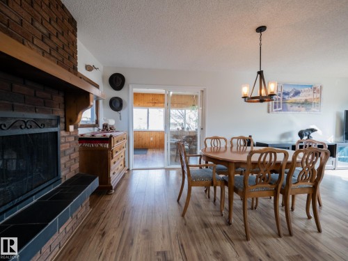 403 4 Street, Rural Lac Ste. Anne County, AB - Indoor Photo Showing Dining Room With Fireplace