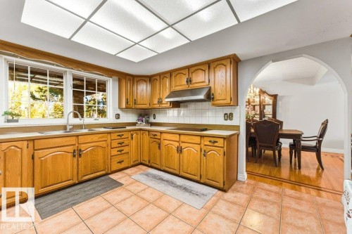 7550 Ellerslie Road, Edmonton, AB - Indoor Photo Showing Kitchen With Double Sink