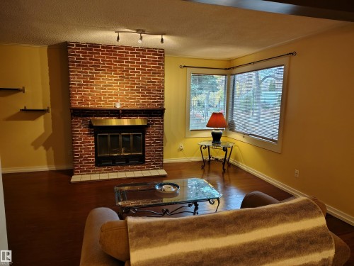 11343 69 Street, Edmonton, AB - Indoor Photo Showing Living Room With Fireplace