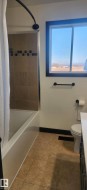 Bathroom with shower / bath combo and vanity - 