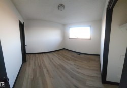 Empty room with light wood-style floors and baseboards - 