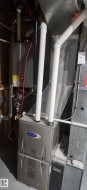 Utility room with heating unit and tankless water heater - 