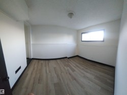 Unfurnished room featuring light wood-style floors and baseboards - 