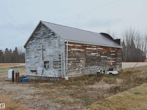 View of home's exterior with a metal roof - 4032A Twp Rd 604, Rural Barrhead County, AB - Outdoor