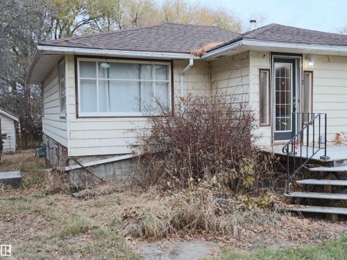 View of side of home with a shingled roof - 4032A Twp Rd 604, Rural Barrhead County, AB - Outdoor