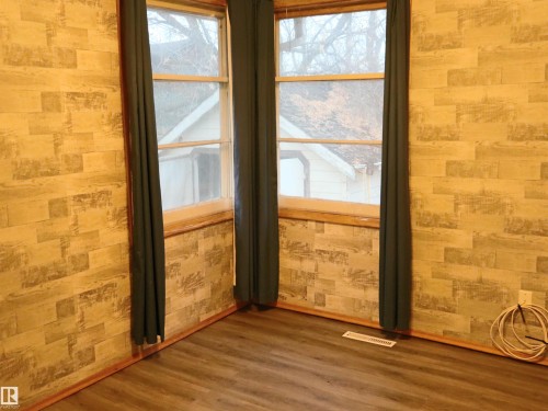 Unfurnished room featuring healthy amount of natural light and wood finished floors - 4032A Twp Rd 604, Rural Barrhead County, AB - Indoor Photo Showing Other Room