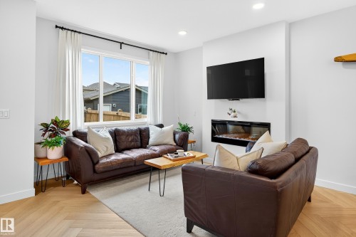 3847 Chrustawka Place, Edmonton, AB - Indoor Photo Showing Living Room With Fireplace