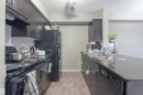 206 3207 James Mowatt Trail, Edmonton, AB  - Indoor Photo Showing Kitchen With Double Sink 