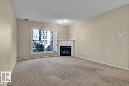 140 16035 132 Street, Edmonton, AB - Indoor Photo Showing Other Room With Fireplace