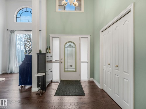Foyer with a towering ceiling and dark wood finished floors - 316 Burton Road, Edmonton, AB - Indoor Photo Showing Other Room