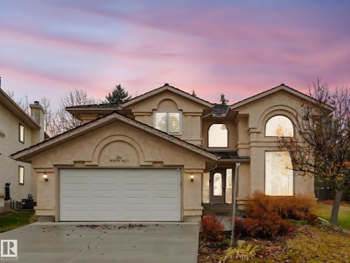 View of front facade with stucco siding, concrete driveway, and a garage - 316 Burton Road, Edmonton, AB - Outdoor