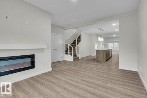 1081 Berg Place, Leduc, AB - Indoor Photo Showing Living Room With Fireplace