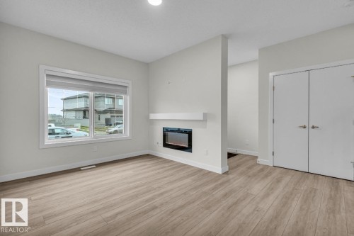 1081 Berg Place, Leduc, AB - Indoor Photo Showing Other Room With Fireplace