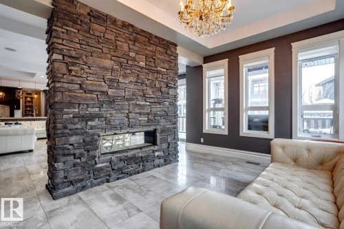 4311 Westcliff Landing Landing, Edmonton, AB - Indoor Photo Showing Living Room With Fireplace