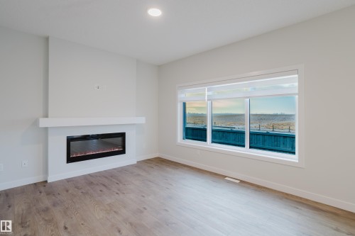 4116 67 Street, Beaumont, AB - Indoor Photo Showing Living Room With Fireplace