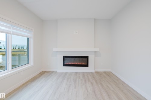 4201 66 Street, Beaumont, AB - Indoor Photo Showing Living Room With Fireplace