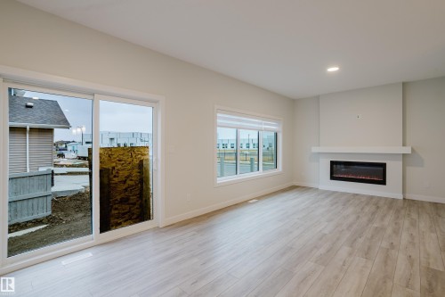 4201 66 Street, Beaumont, AB - Indoor Photo Showing Living Room With Fireplace
