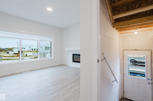 4201 66 Street, Beaumont, AB - Indoor Photo Showing Other Room With Fireplace