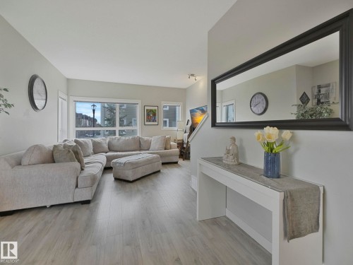 124 2560 Pegasus Boulevard, Edmonton, AB - Indoor Photo Showing Living Room