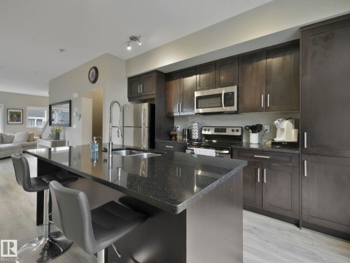 124 2560 Pegasus Boulevard, Edmonton, AB - Indoor Photo Showing Kitchen With Double Sink With Upgraded Kitchen