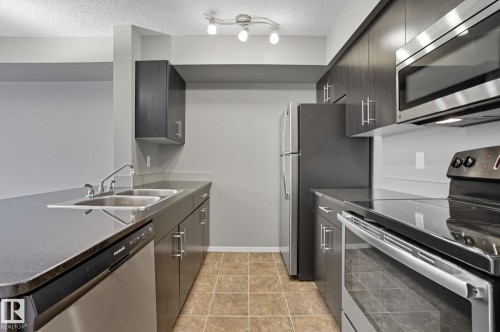 125 3315 James Mowatt Trail, Edmonton, AB - Indoor Photo Showing Kitchen With Stainless Steel Kitchen With Double Sink