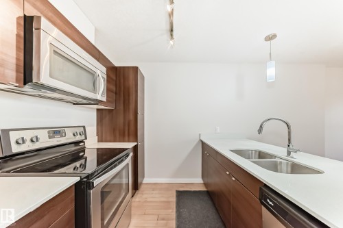 101 9519 160 Avenue, Edmonton, AB - Indoor Photo Showing Kitchen With Stainless Steel Kitchen With Double Sink