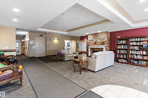 408 14259 50 Street, Edmonton, AB - Indoor Photo Showing Other Room With Fireplace