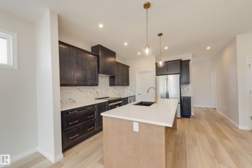 172 Stonehouse Way, Leduc, AB - Indoor Photo Showing Kitchen With Upgraded Kitchen