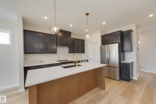 172 Stonehouse Way, Leduc, AB - Indoor Photo Showing Kitchen With Stainless Steel Kitchen With Double Sink With Upgraded Kitchen