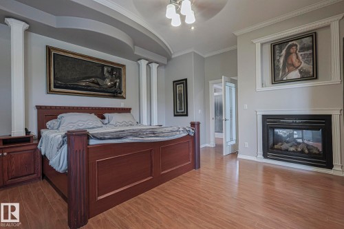 4 Third Avenue, Entwistle, AB - Indoor Photo Showing Bedroom With Fireplace