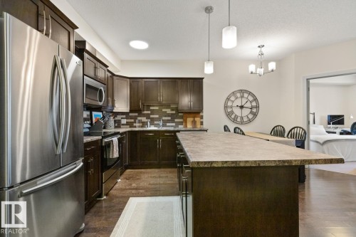 114 10520 56 Avenue, Edmonton, AB - Indoor Photo Showing Kitchen With Stainless Steel Kitchen With Upgraded Kitchen