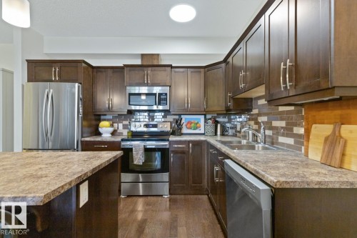 114 10520 56 Avenue, Edmonton, AB - Indoor Photo Showing Kitchen With Stainless Steel Kitchen With Double Sink With Upgraded Kitchen
