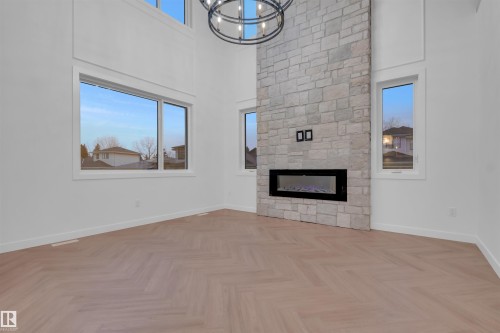 151 Graybriar Drive, Stony Plain, AB - Indoor Photo Showing Other Room With Fireplace