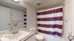 Bathroom with vanity and shower / bath combination with curtain - 
