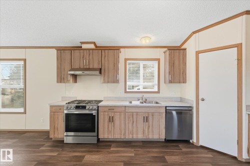 242 305 Calahoo Road, Spruce Grove, AB - Indoor Photo Showing Kitchen With Double Sink