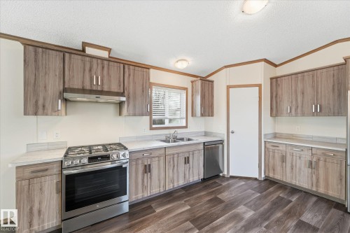 242 305 Calahoo Road, Spruce Grove, AB - Indoor Photo Showing Kitchen With Double Sink
