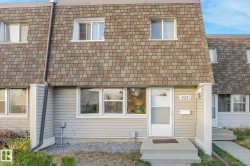 View of front of property featuring a shingled roof - 