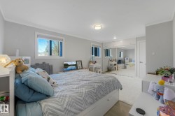 Bedroom featuring a closet, crown molding, and wood finished floors - 
