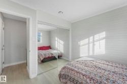 Bedroom featuring wood finished floors, a closet, and ornamental molding - 