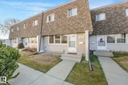 View of front of home featuring roof with shingles, entry steps, a front lawn, and mansard roof - 