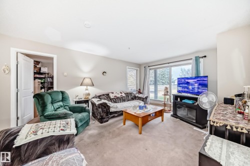 102 13907 136 Street Nw, Edmonton, AB - Indoor Photo Showing Living Room