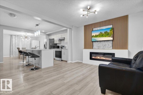 1248 Rosenthal Boulevard, Edmonton, AB - Indoor Photo Showing Other Room With Fireplace
