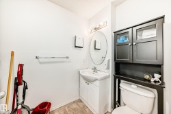 Half bath featuring vanity and toilet - 