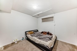 Carpeted bedroom featuring baseboards - 